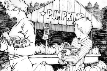 Boy looking at pumpkins