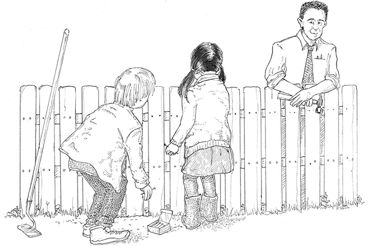 kids looking at teacher over the fence